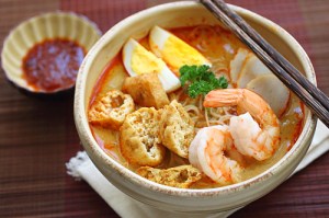 Curry laksa - eat with a spoon to slurp up the delicious broth and fried tofu puffs (click for recipe from rasamalaysia.com)